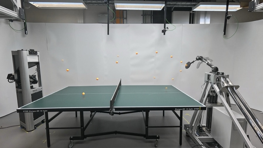 Muscle-actuated robot arm returning table tennis balls, with ball trajectories overlaid